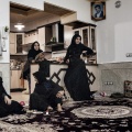 Women gathered at home after the commemorations for the Imam Hossein. Nooshabad, Iran, November 2012.